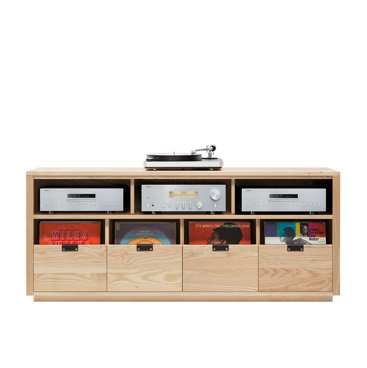 a wooden entertainment center with drawers and an audio player