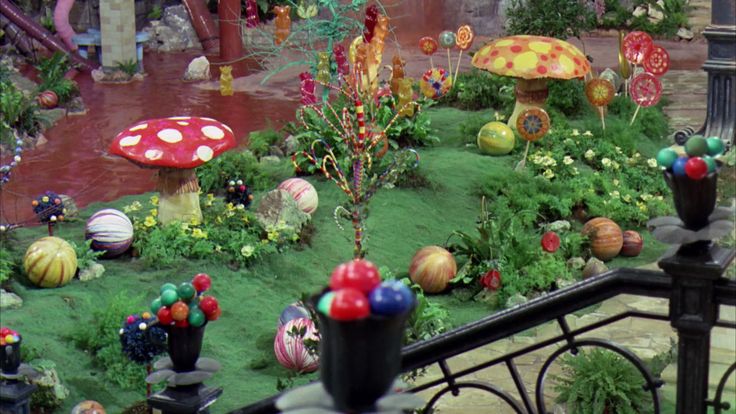 a garden with lots of fake mushrooms and flowers