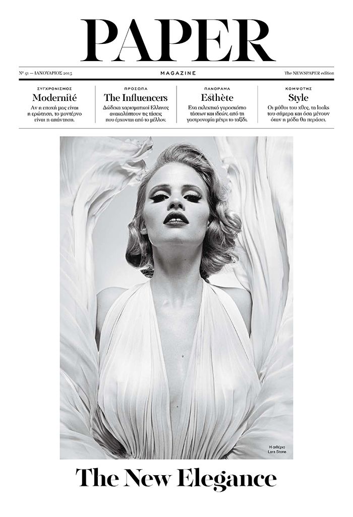 the front page of paper magazine with a woman in white dress and wings on it