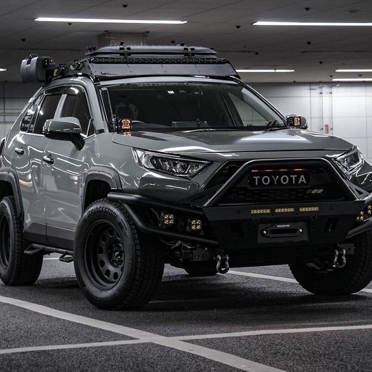 a grey toyota truck parked in a parking garage