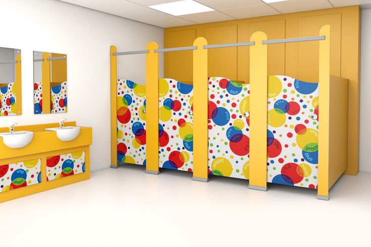 the bathroom is decorated in bright colors and polka dot print, with two sinks and three mirrors