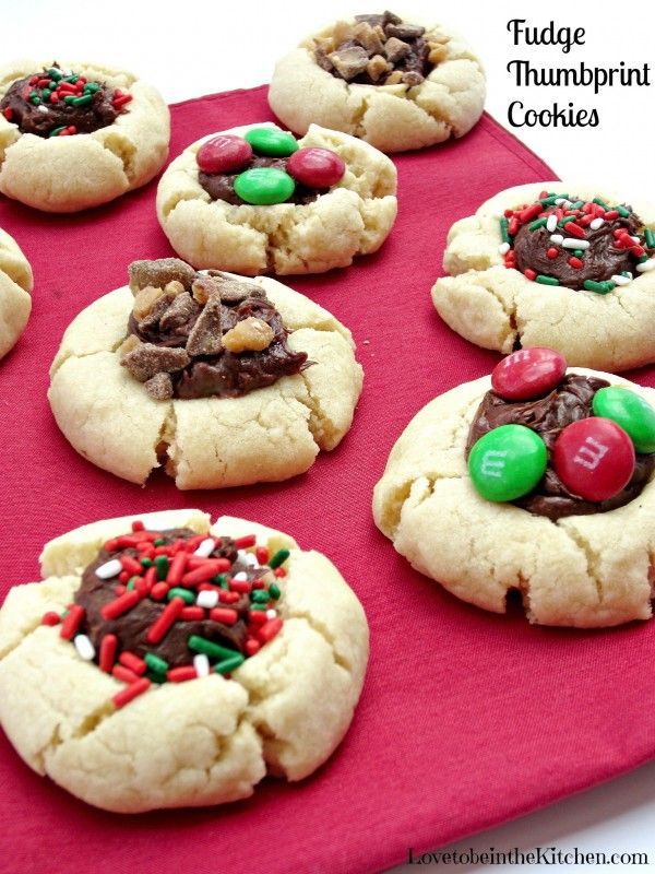 cookies decorated with candy and candies on a red tray