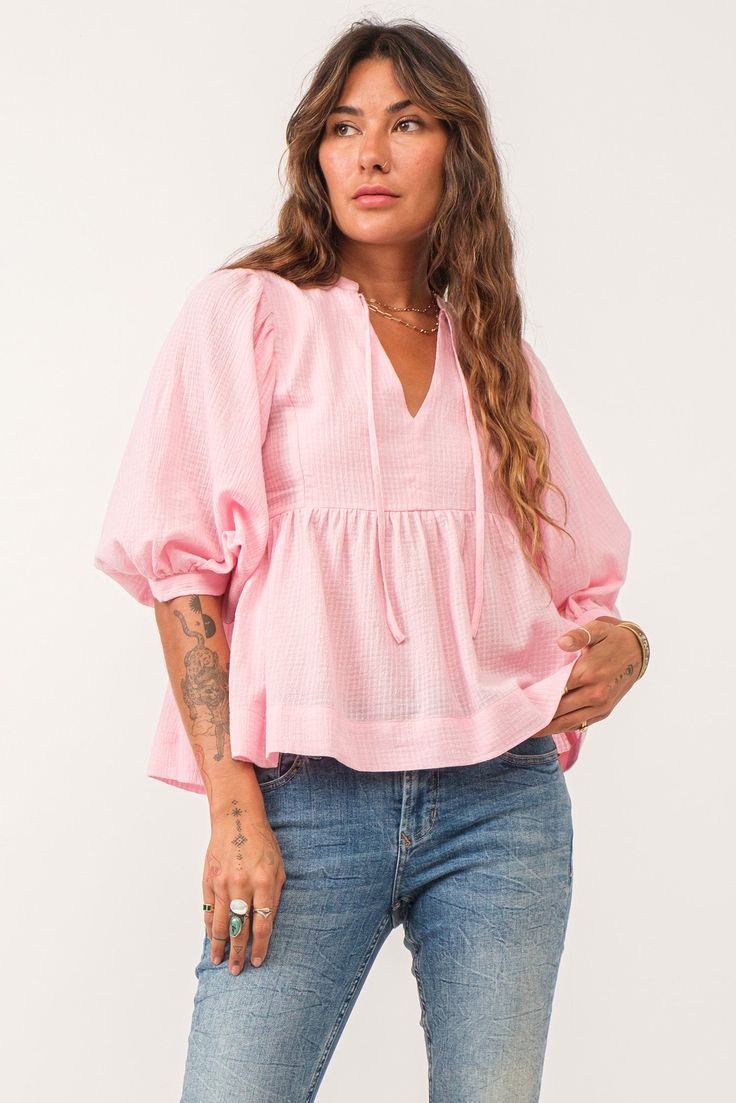 image of a female model wearing a MALIA V-NECK TOP PINK SORBET DEAR JOHN DENIM Feminine Cotton Peasant Top For Brunch, Feminine Cotton Peasant Top For Spring, Spring Cotton Blouse With 3/4 Sleeves, Cotton V-neck Peasant Top For Brunch, Spring V-neck Relaxed Fit Peasant Top, Spring V-neck Peasant Top With Relaxed Fit, Chic Pink Peasant Top For Summer, Pink Relaxed Fit Blouse For Brunch, Pink Cotton Top With 3/4 Sleeves