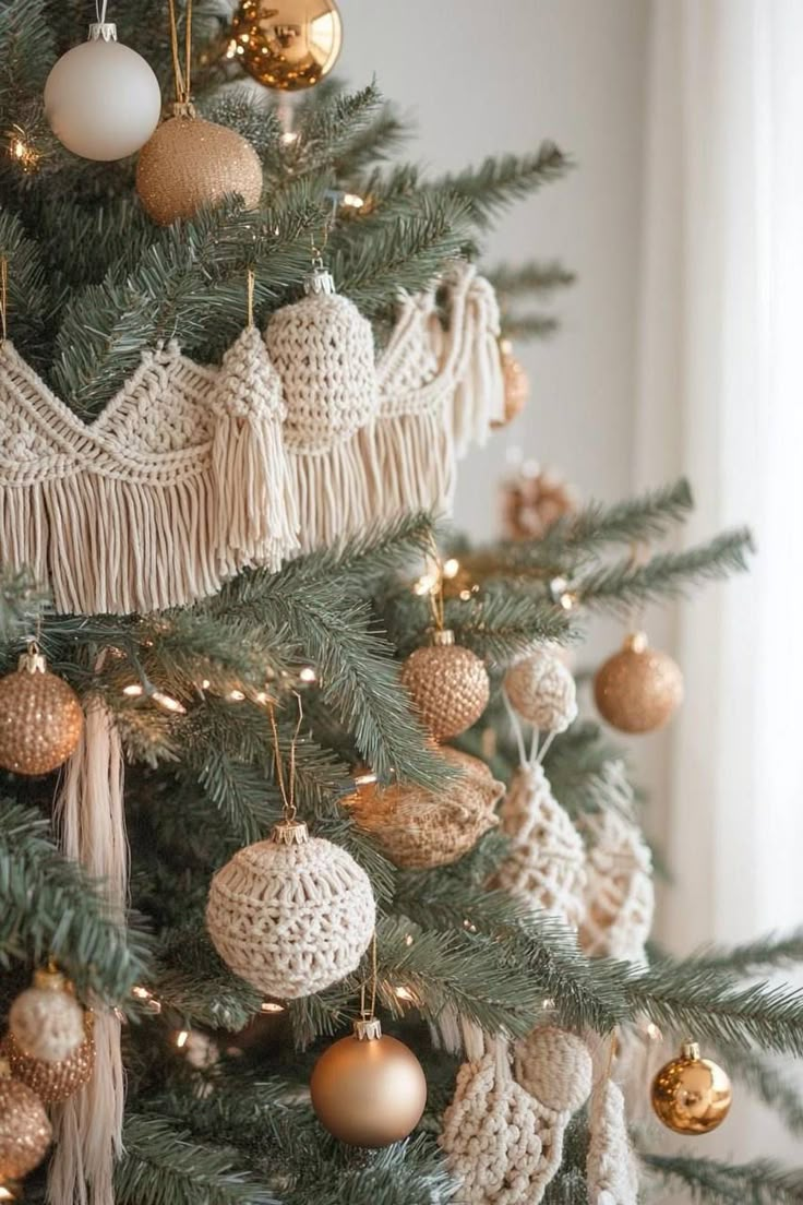 a christmas tree decorated with gold and white ornaments