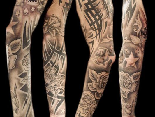 several different tattoos on both arms and legs