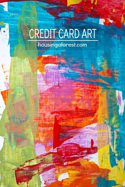 the words credit card art are painted on top of colorful paint and paper with brush strokes