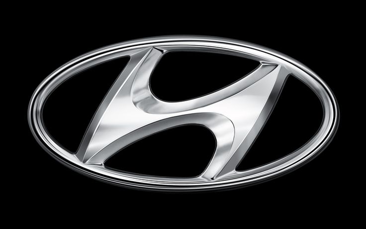 the front emblem of a car on a black background