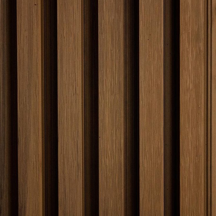 a close up view of the wood grains on a door frame with vertical stripes