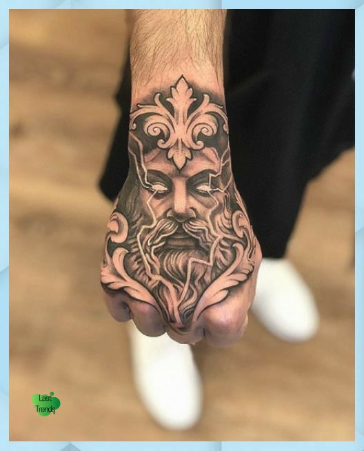 a man's hand with a tattoo on it and an image of a face