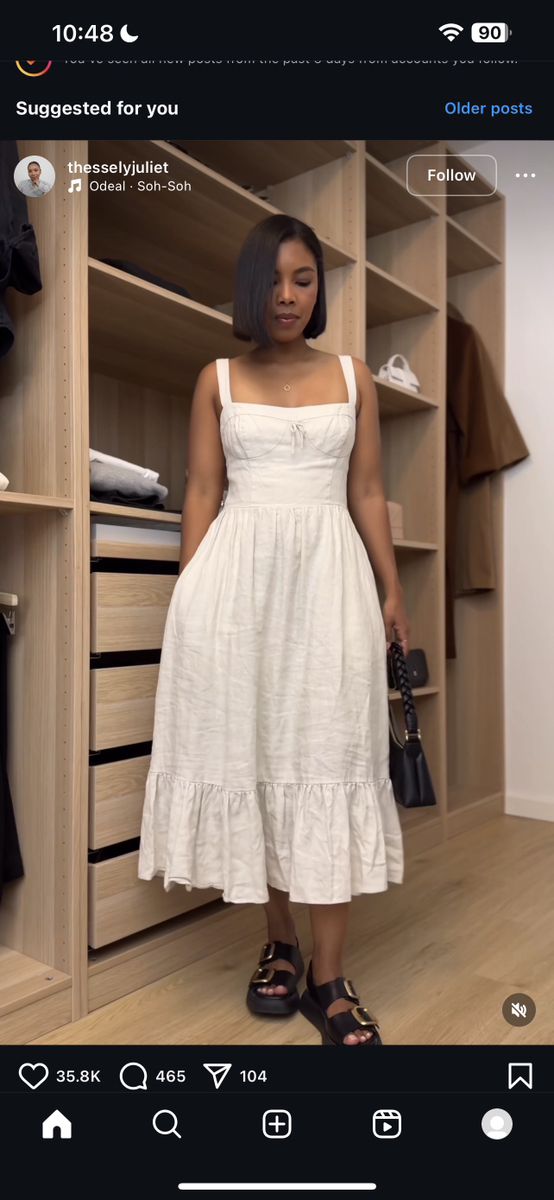 a woman standing in front of a closet