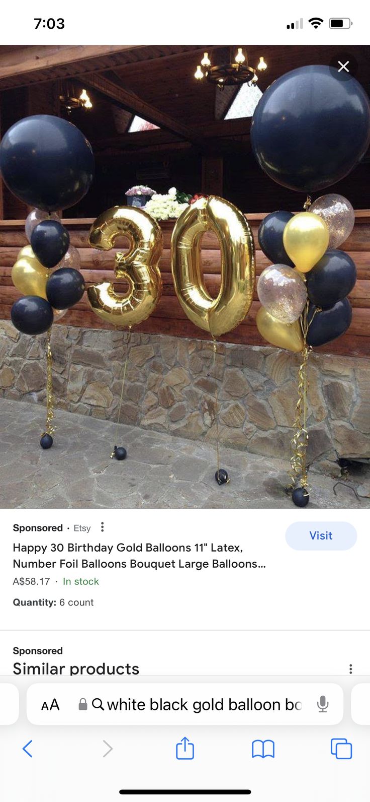 an email post with balloons and the number thirty five in gold, black and silver