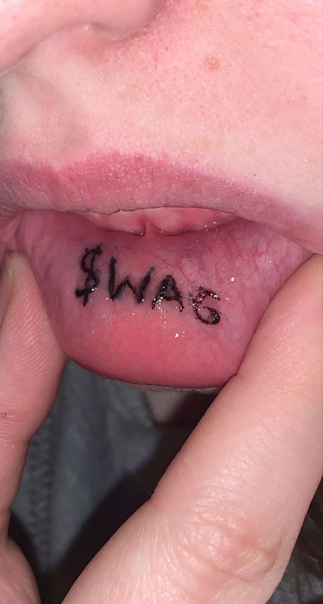 someone has written the word swag on their tongue