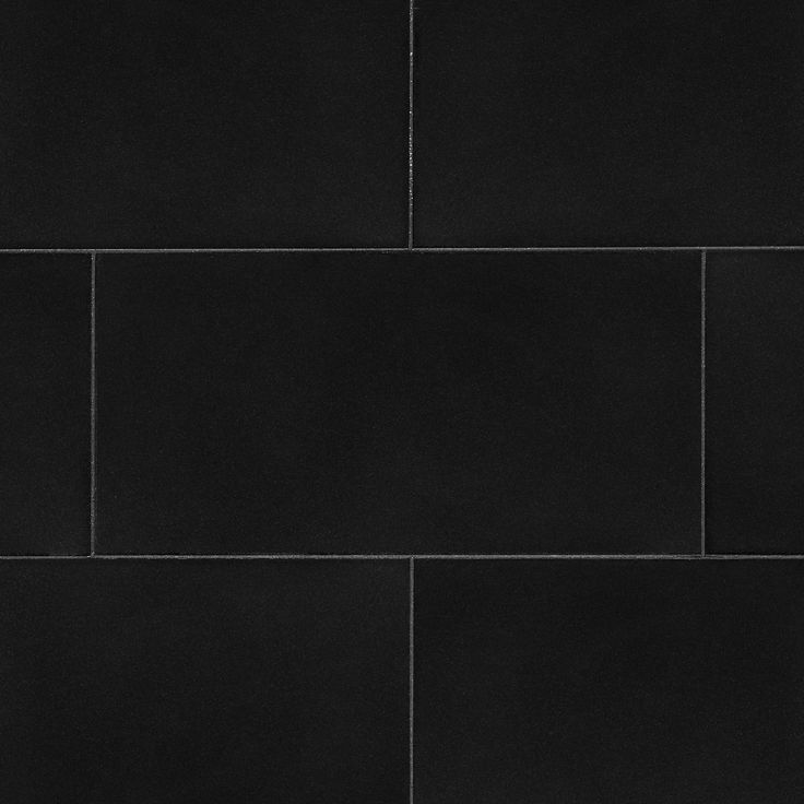 a black tile wall that is very dark