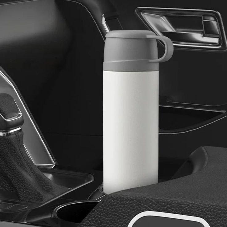 the interior of a car with a cup holder