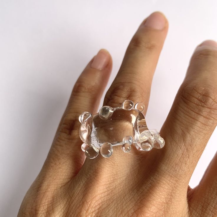 "Welcome to Hidden Glass Atelier! Glad you have found me  ✦ DESIGN    ✧ Simple and elegant band with waves like deco, handmade with clear transparent Murano glass.    ✧ Two styles: chunky and dainty to choose from    ✧ Styling: It is chic to wear alone, or stack with other metal rings for an interesting mix of material look and a pop of color. It is easy to wear up or down with a casual outfit or for a special occasion.  There is a similar style of earrings you could find it here: https://hiddenglassatelier.etsy.com/listing/1598972468    ✧ Durability: All the glass jewelry pieces are tempered by a professional kiln to provide maximum durability.    ✧ Origin: This one-of-a-kind glass ring will be custom handmade for you by me from Murano Venice Italy - the very heart of glass art since the Unique Clear Crystal Ring For Gift, Unique Clear Crystal Ring As A Gift, Unique Clear Resin Rings, Modern Resin Rings For Gifts, Adjustable Clear Rings, Unique Clear Resin Ring, Unique Resin Crystal Ring Gift, Modern Resin Jewelry For Gifts, Modern White Rings For Party