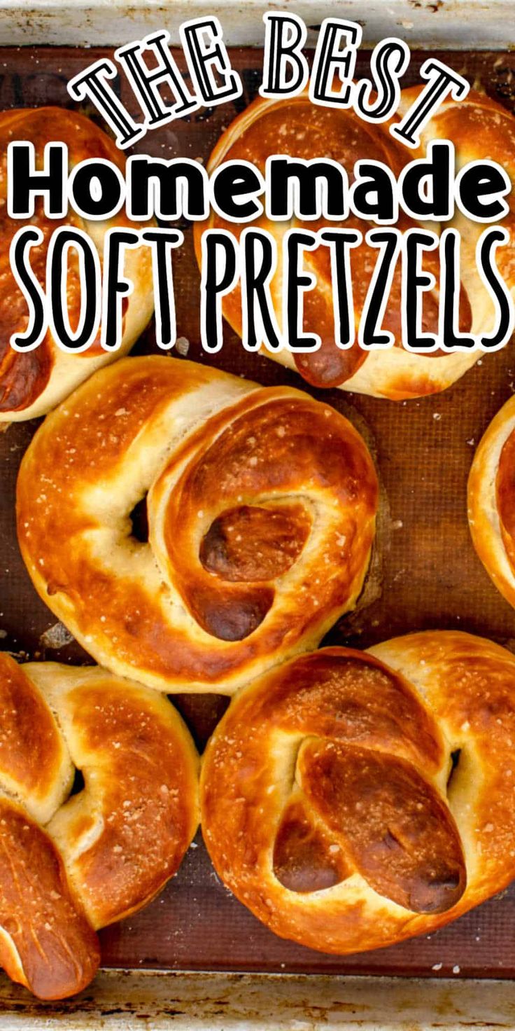 homemade soft pretzels on a baking sheet with text overlay that reads, the best homemade soft pretzels