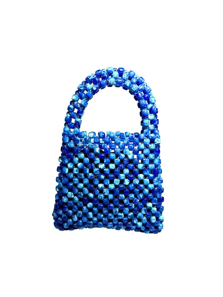 Artisan Beaded Handbag.Designed in NYC. Crafted with precision in the heart of Lagos, Nigeria.Elevate your style with our exquisite beaded handbags – a timeless accessory that seamlessly blends sophistication with versatility. Meticulously handcrafted, these bags are built to withstand the test of time. Whether paired with a cocktail dress, jeans and a tee, professional attire, or your favorite clubwear, our bead bags effortlessly complement any ensemble. Luxury Beaded Bags For Everyday Use, Handheld Brown Beaded Bag, Blue Beaded Bag, Chic Luxury Beaded Bags, Unique Beaded Everyday Bags, Dress Jeans, Bead Bag, Lagos Nigeria, Beaded Handbag