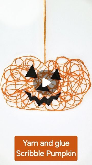 yarn and glue scribble pumpkin ornament craft for kids to make with yarn