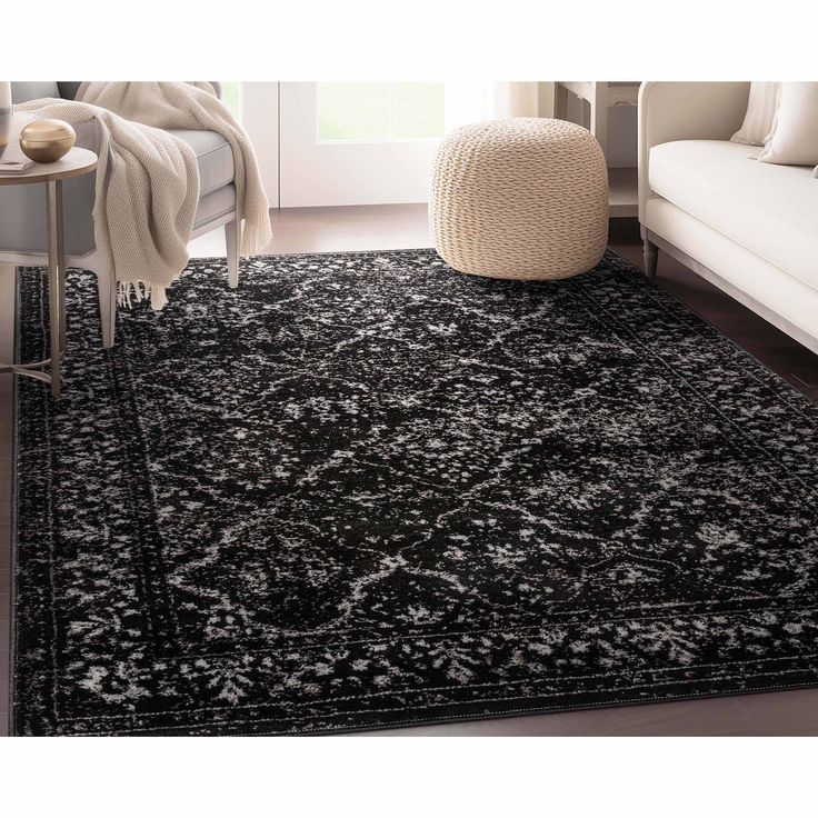 a black and white rug in a living room