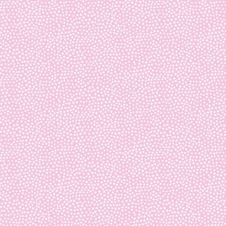 a pink background with white polka dots