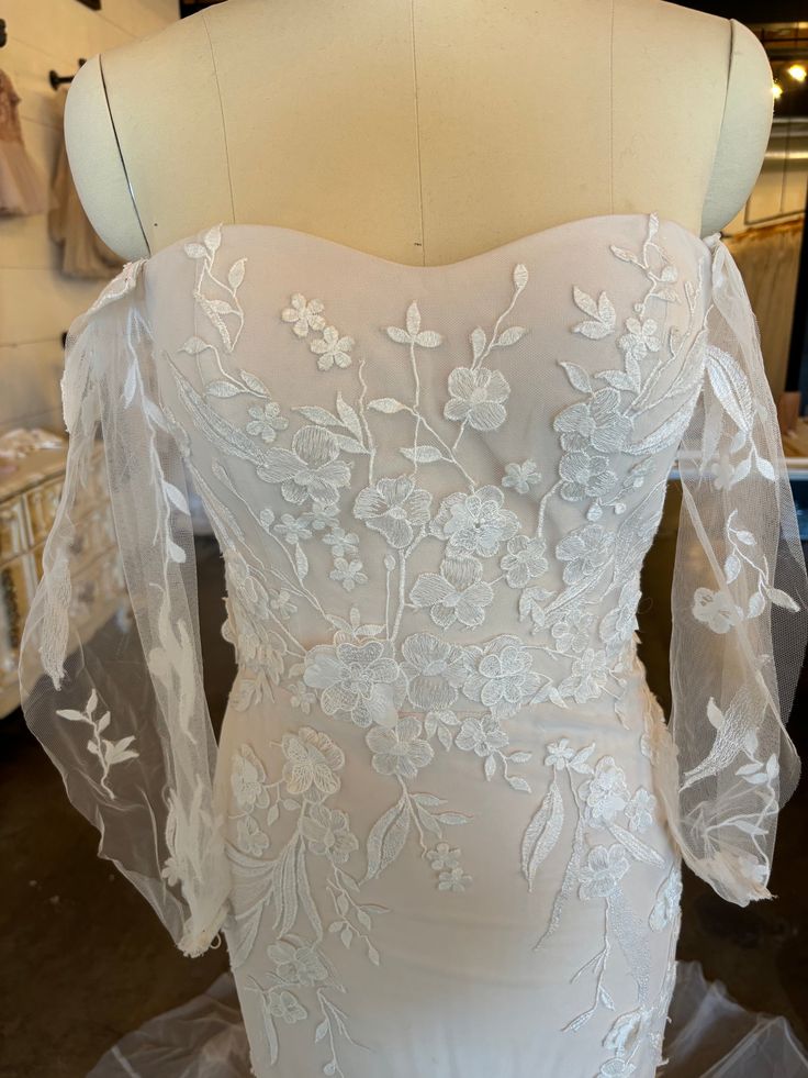 the back of a wedding dress on display