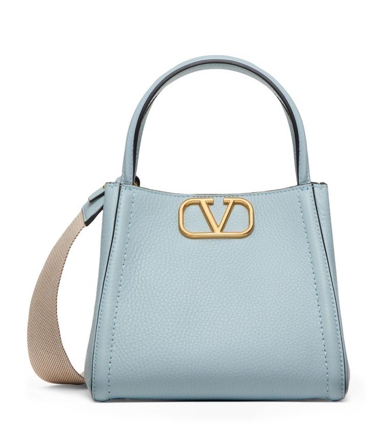 Find VALENTINO Alltime Top-handle Bag on Editorialist. The Valentino Garavani Alltime top-handle bag is crafted from Italian calfskin. It features a boxy shape and a gold-tone VLogo. The bag has a top handle and an adjustable shoulder strap. It is made in Italy. Bamford Watch, Valentino Bag, Trainer Boots, Valentino Bags, Boots Knee, Luggage Accessories, Cute Bags, Sequin Top, Handle Bag