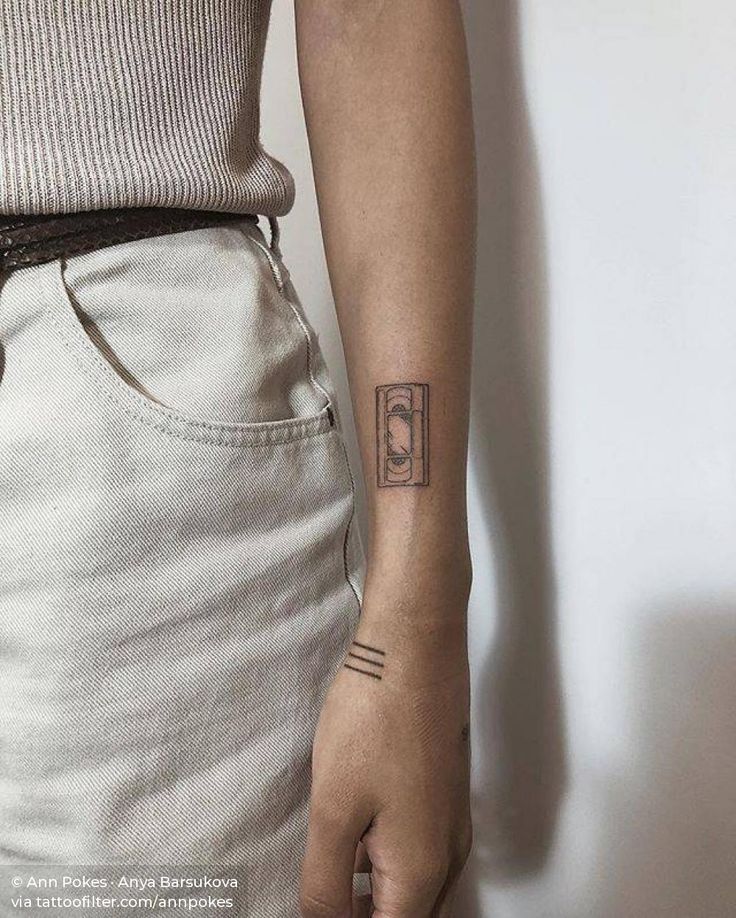 a person with a small tattoo on their arm