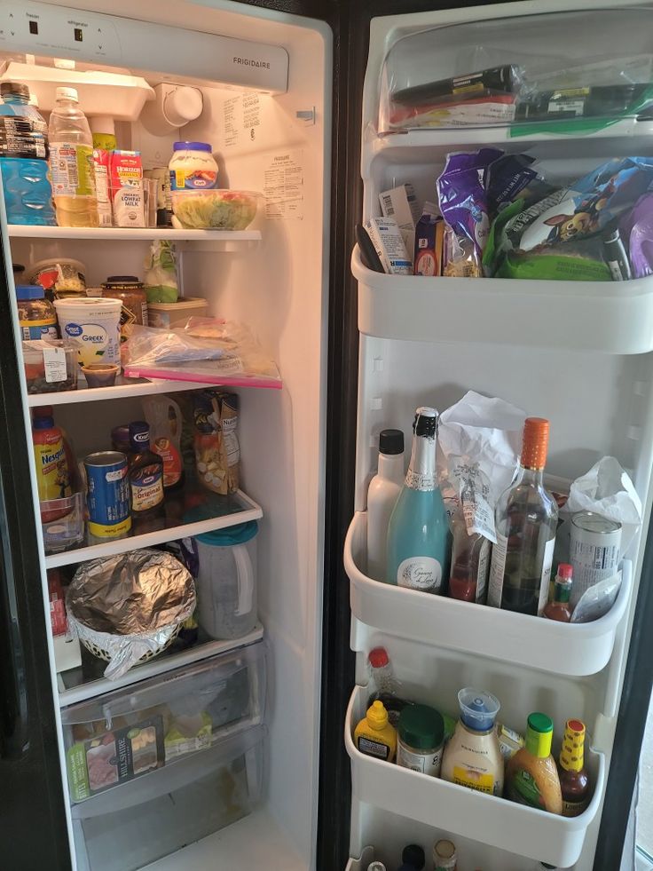 an open refrigerator filled with lots of food