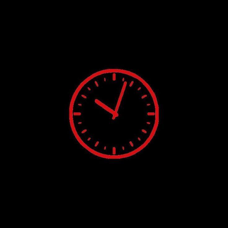 a red clock on a black background