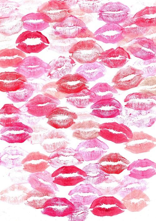 lipstick kisses drawn on paper with pink and red colors in the shape of an abstract pattern