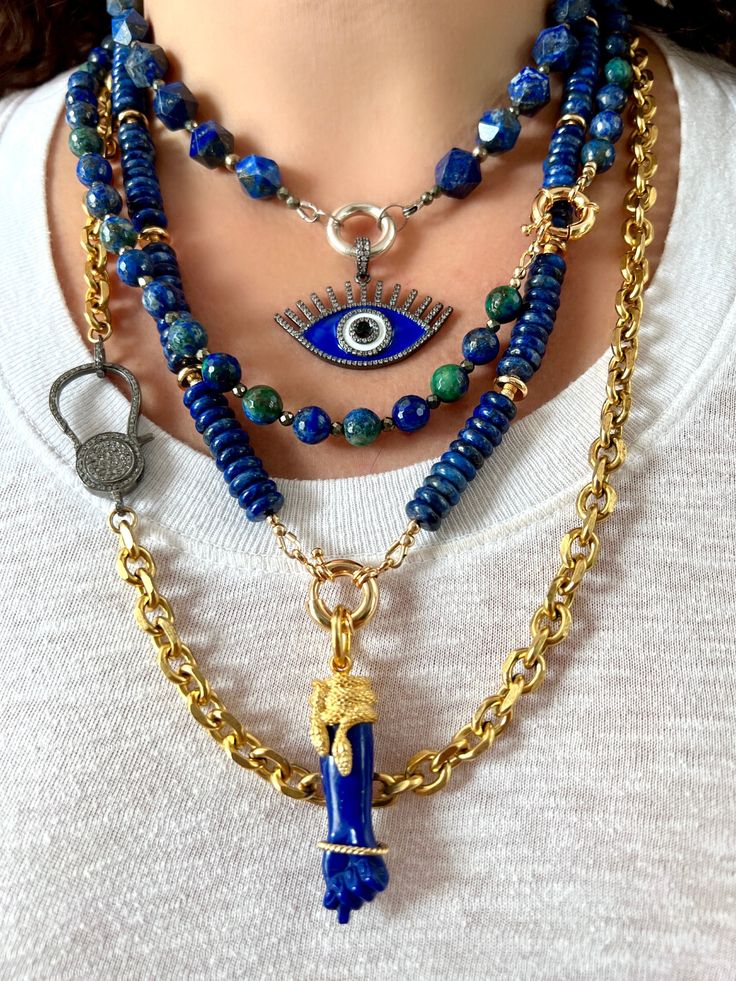 This handmade, one-of-a-kind beaded gemstone necklace features gorgeous faceted malachite, azurite and chrysocolla beads, which occur together in nature. The beautiful blue-green beads are spaced here with pyrite beads, and finished with an 18k gold-plated sailor clasp, which also doubles as a charm holder (charms sold separately). Together, malachite, azurite and chrysocolla work synergistically to provide the wearer with deep healing, protection and clear communication. Pyrite is a very grounding stone and offers an additional layer of protection to those who wear it.    --- CARE INSTRUCTIONS All of Rocks and Stars' pieces are delicate and require proper care.  Please follow the guidelines below to preserve your piece: * Do not expose the jewelry to water.  Remove before showering and sw Luxury Turquoise Amulet Necklace With Natural Stones, Lapis Lazuli Gemstone Beads Pendant Jewelry, Spiritual Beaded Malachite Jewelry, Spiritual Malachite Beaded Jewelry, Artisan Malachite Gemstone Jewelry, Lapis Lazuli Jewelry With Faceted Beads, Healing Lapis Lazuli Jewelry With Faceted Beads, Artisan Jewelry With Natural Malachite Stones, Artisan Malachite Jewelry With Natural Stones