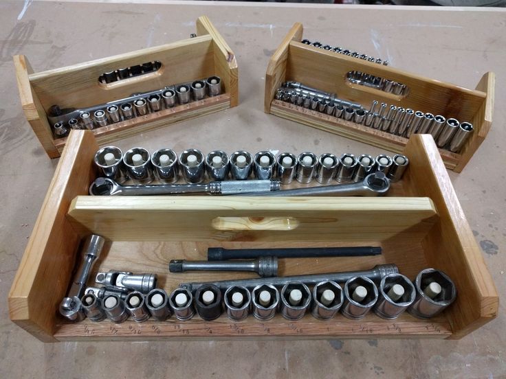 a wooden box filled with lots of tools