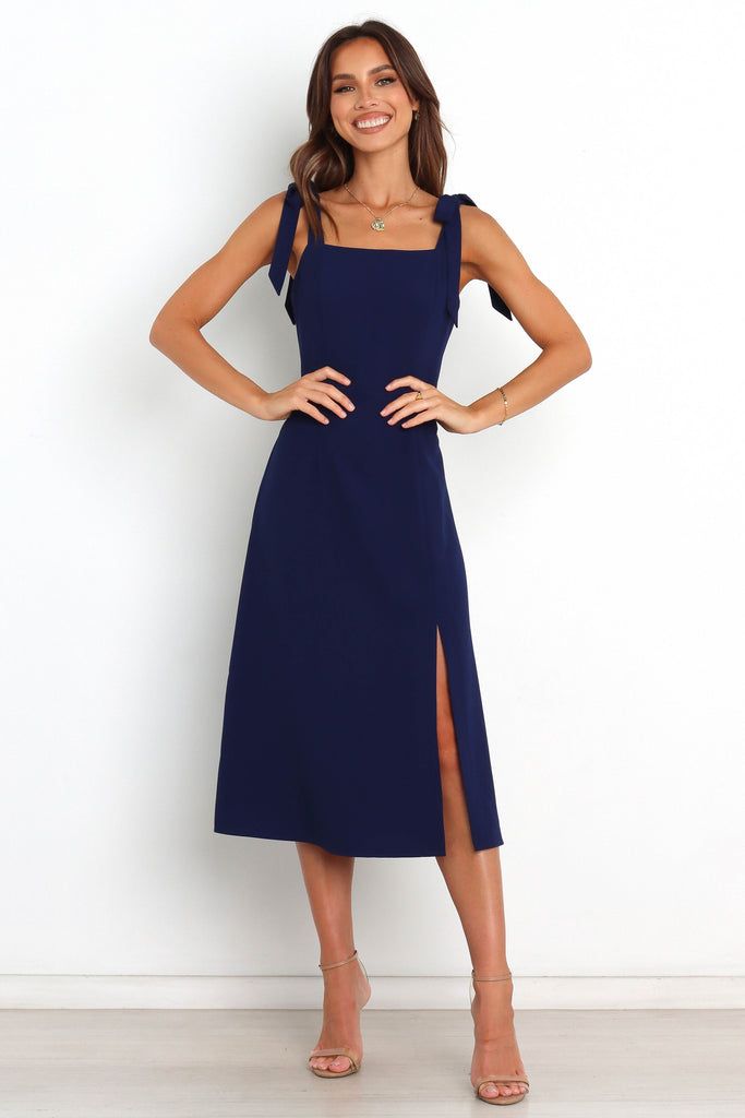 Laurel Dress - Navy - Petal & Pup USA Straight Neckline Dress With Tie Back For Date Night, Fitted Midi Dress With Tie Back And Straight Neckline, Tie-back Midi Dress For Night Out, Chic Midi Length Dresses With Straps, Square Neck Tie Back Dress For Night Out, Fitted Suspender Dress With Tie Straps For Brunch, Elegant Square Neck Midi Dress With Tie Back, Elegant Midi Length Dress With Straps, Party Midi Dress With Straight Neckline And Tie Back