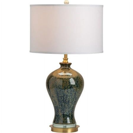 a table lamp with a white shade on it