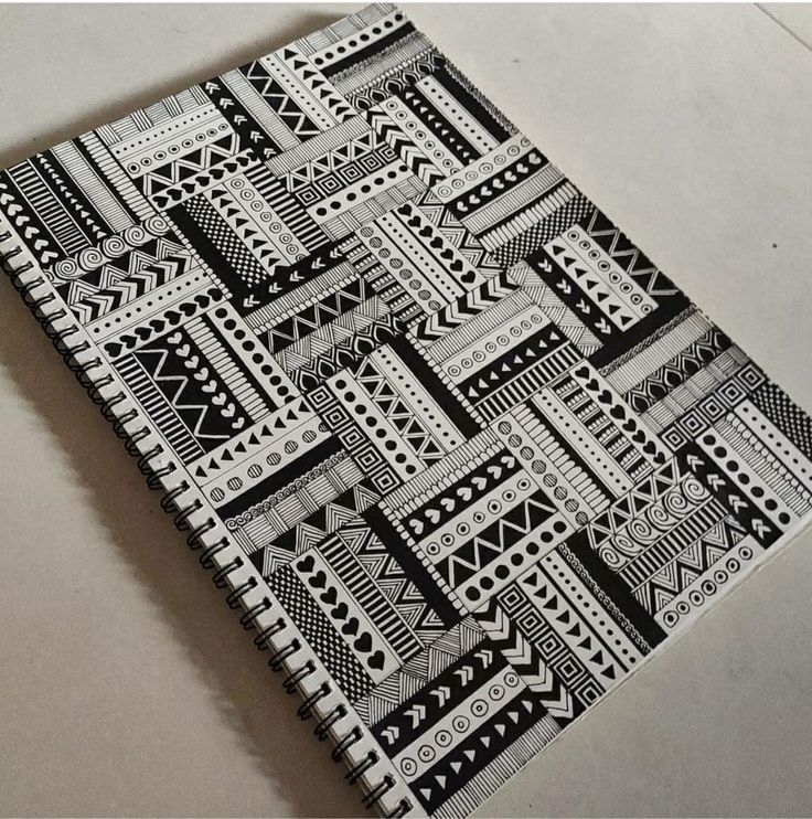 a black and white patterned notebook on a table