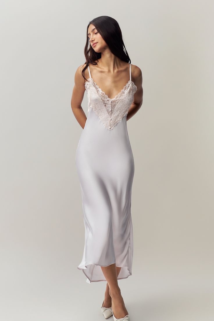 Indulge in timeless elegance with the Nova Slip Midi Dress. Crafted from luxurious satin, this dress drapes beautifully, enhancing your natural grace. The lace front adds a touch of romance and sophistication, while the adjustable straps ensure a perfect, personalized fit. Ideal for special occasions or a chic evening Lace Satin Slip Dress, White Silk Lace Dress, Silk Slip Dress Outfit, White Lace Slip Dress, Silk Lace Dress, Wedding Miscellaneous, Night Gown Dress, White Silk Dress, Slip Midi Dress