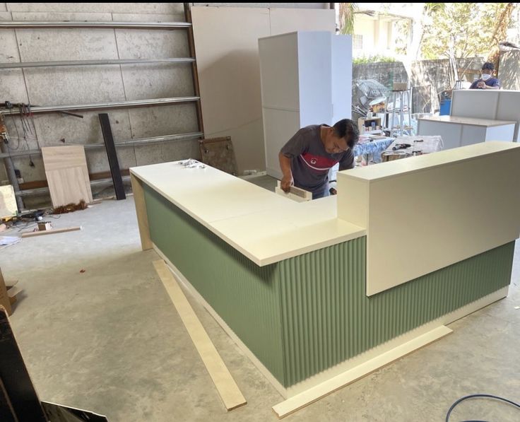 a man working on a counter in a building