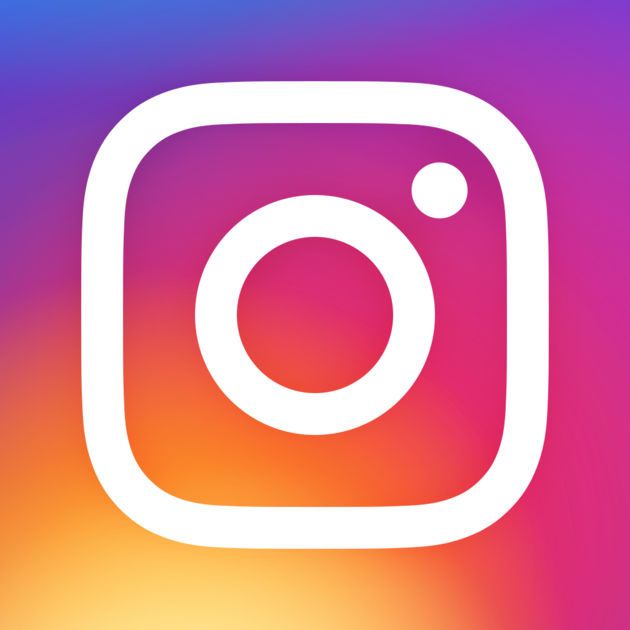 the instagram logo is shown on a blurry purple and blue background with white circles