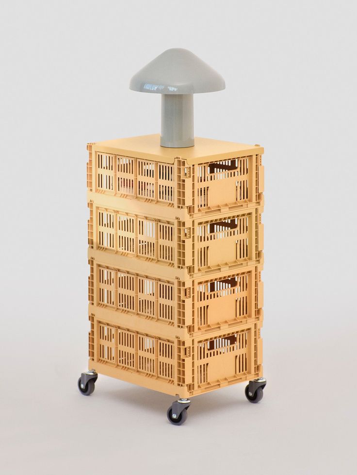 a stack of crates sitting on top of each other in front of a white background