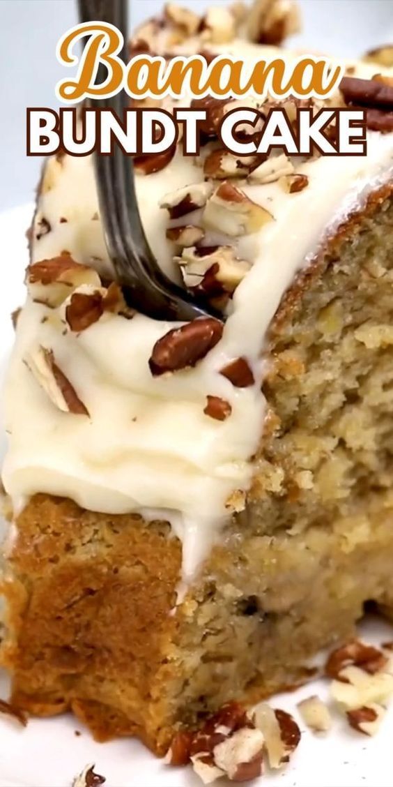 a slice of banana bundt cake with white frosting and pecans on top