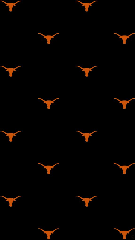 an orange cow skull on a black background with long horns in the shape of cows