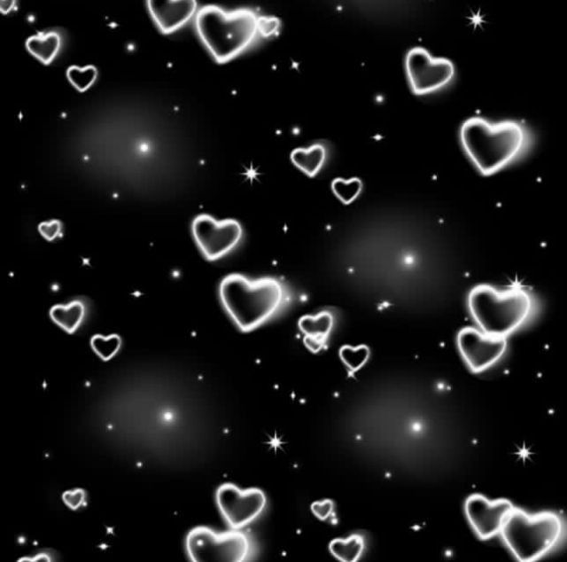 many white hearts floating in the air on a black background with stars and sparkles