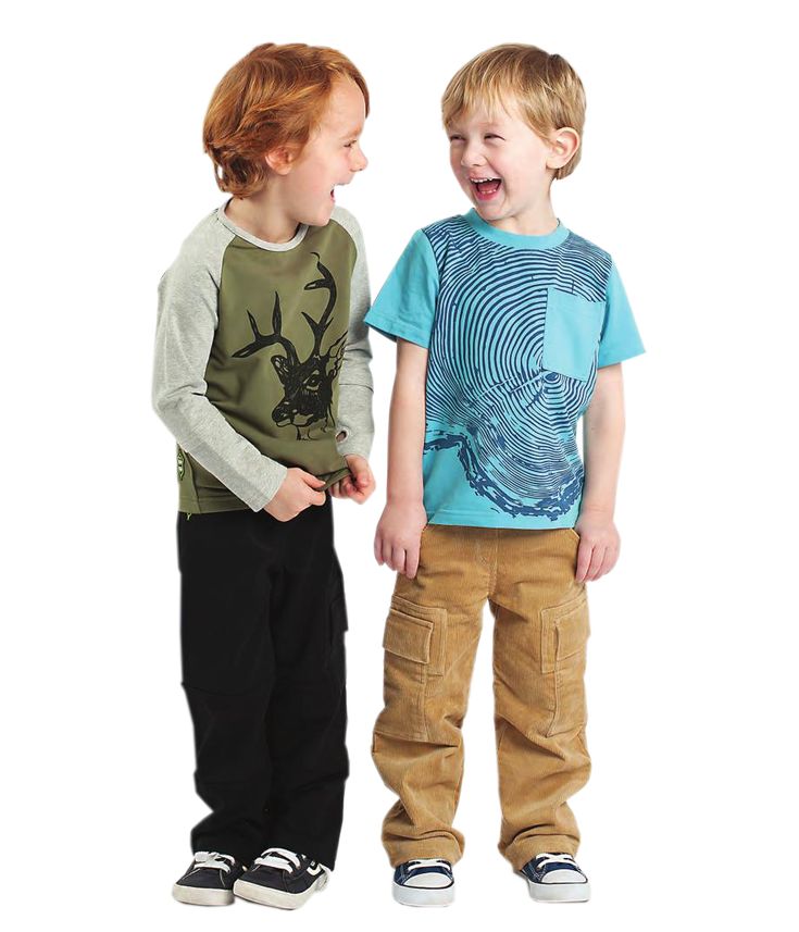 two young boys standing next to each other with their hands in their pockets and mouths open