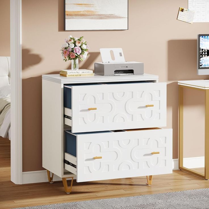 a white dresser with two drawers and a printer on top