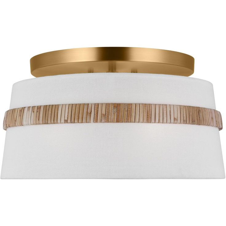 a close up of a light fixture with white fabric and gold trim on the bottom