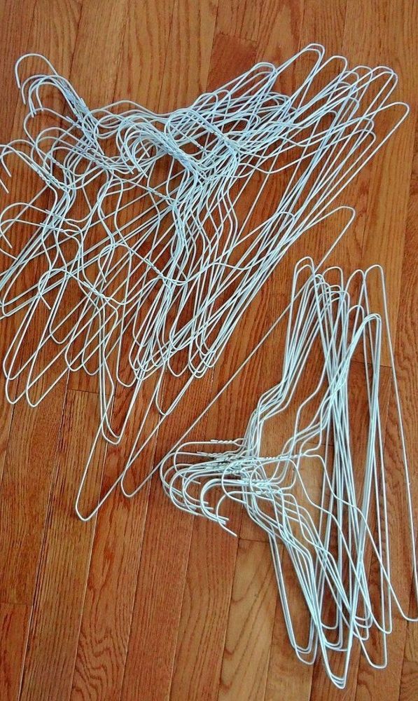 several pieces of white wire sitting on top of a wooden floor