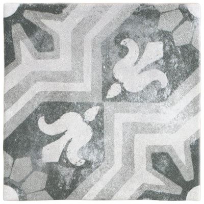 a black and white rug with an abstract design