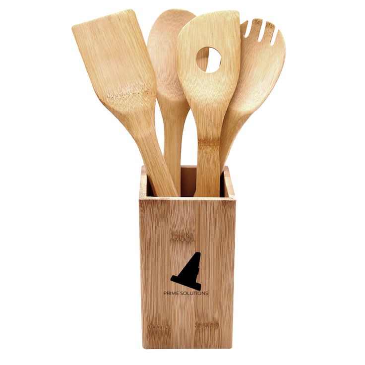 four wooden utensils in a holder