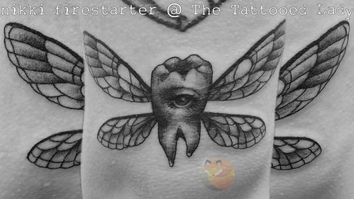 a woman's chest with an insect tattoo on it and the words inkfirster