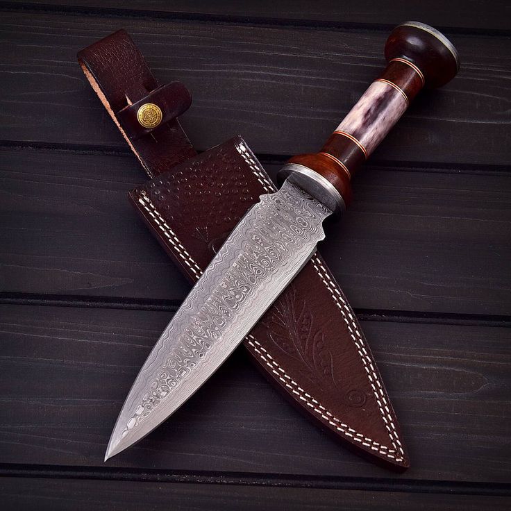 a knife with a leather sheath on it